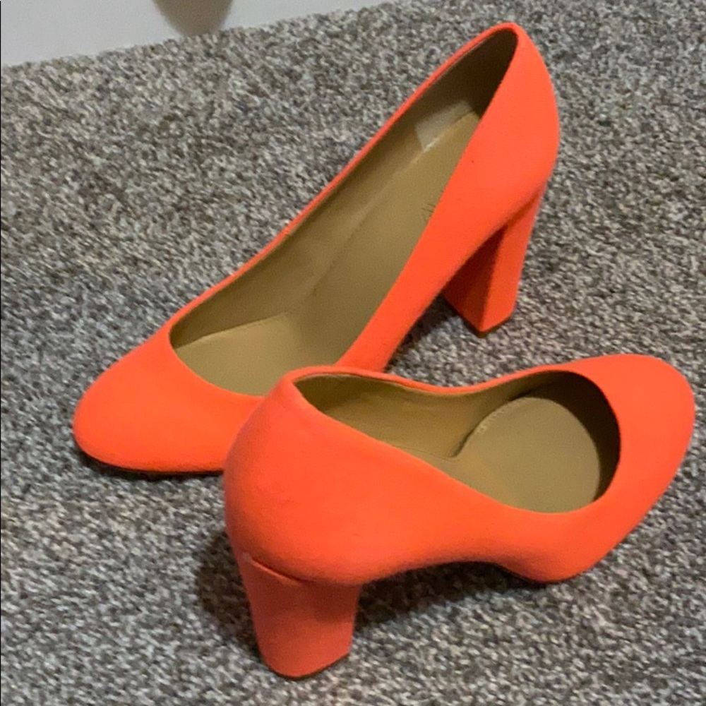 Neon orange canvas pump.